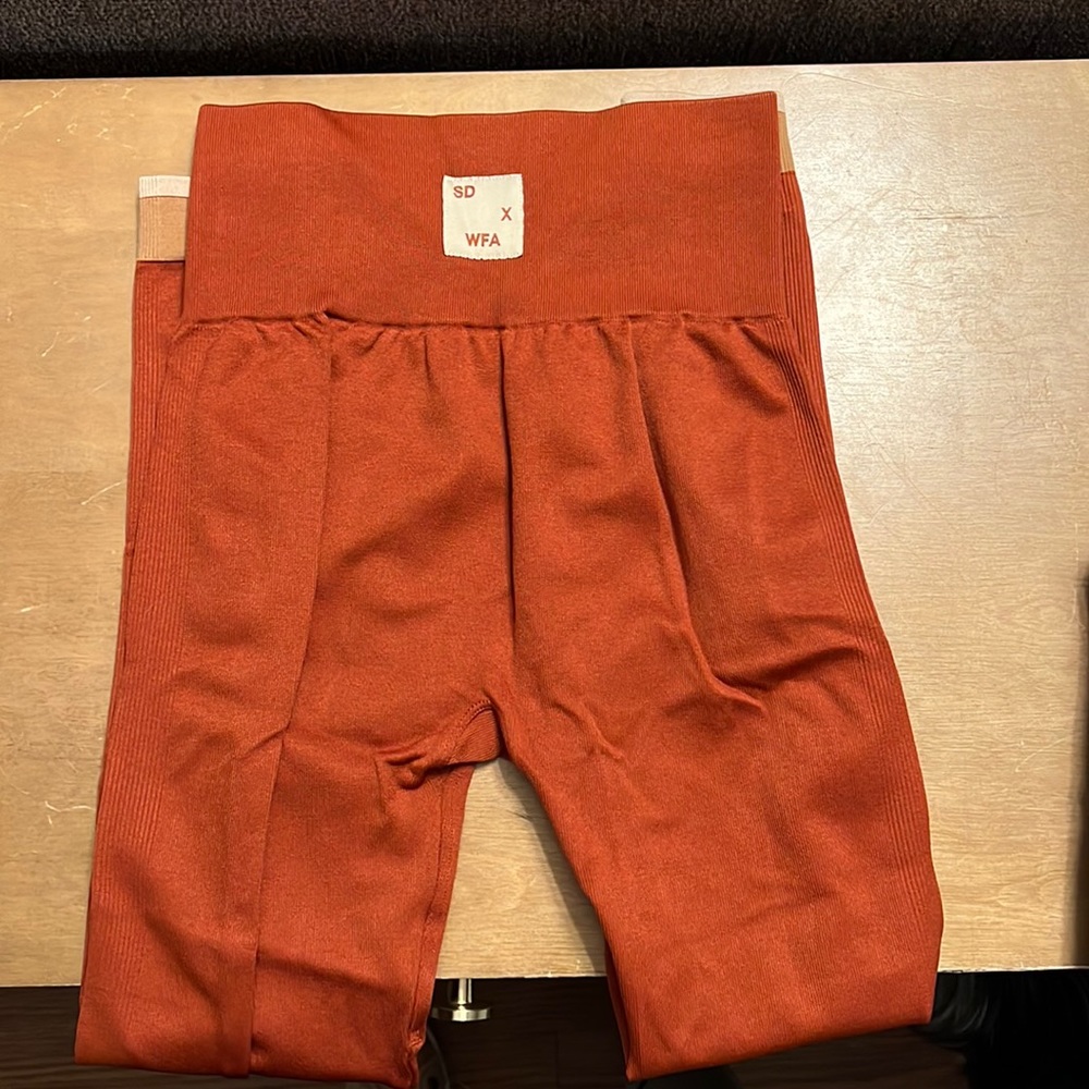 Sarah’s day deep orange legging. Brand new condition, no tags.